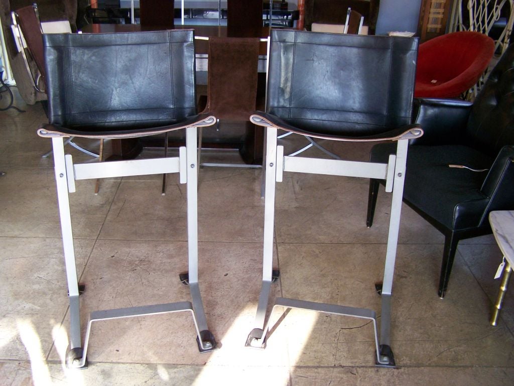 Pair of black leather and steel bar stools by Max Gottschalk.

Max Gottschalk was a little-known American Mid-Century Modern interior designer who worked with leather and 