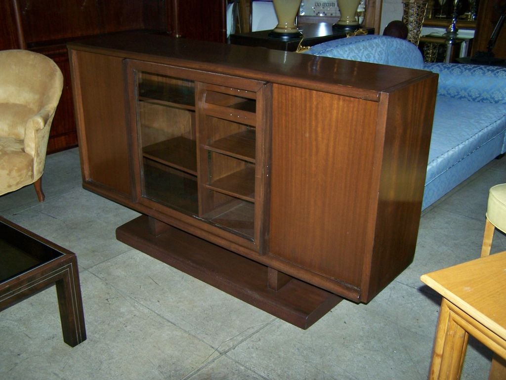 Light mahogany French sideboard buffet with one slicing and two doors designed by Marcel Gascoin.