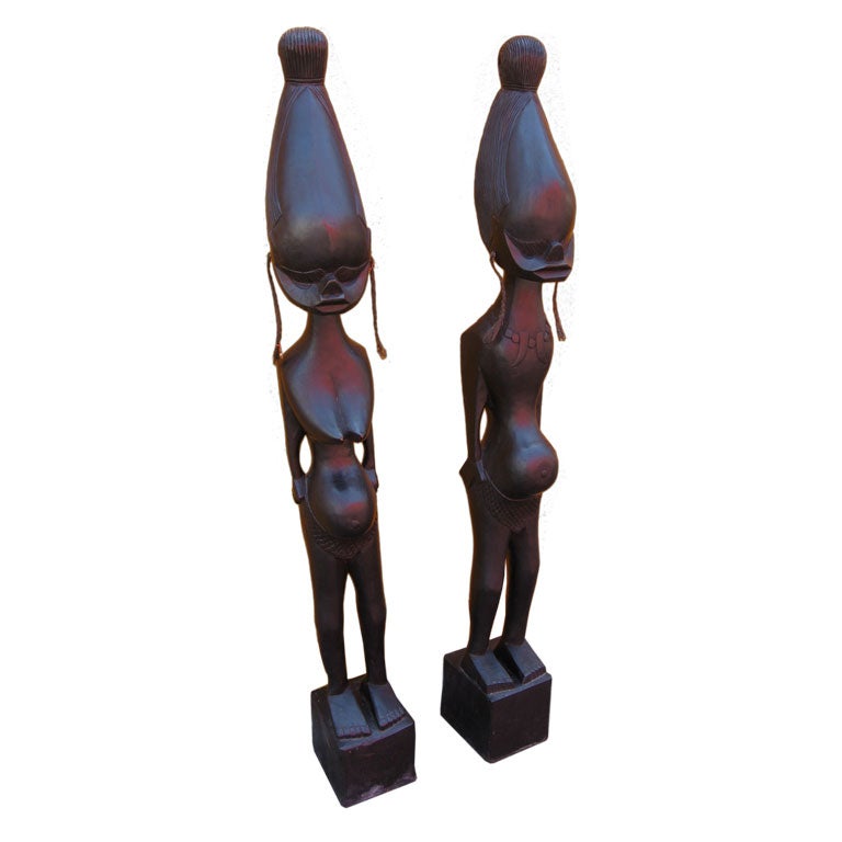 Tall pair of stylized realism Statues