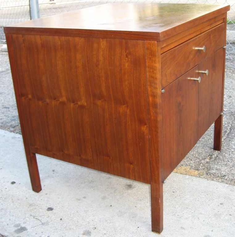 Pair of walnut nightstands ample in size with one drawer and 2 doors. Manufactured by Lane.