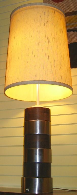 Distinctive oak and brushed metal Russell Wright designed table lamp of substantial dimensions and masculine strength.