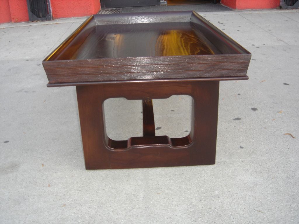 Dark oak coffee table by Paul Frankl