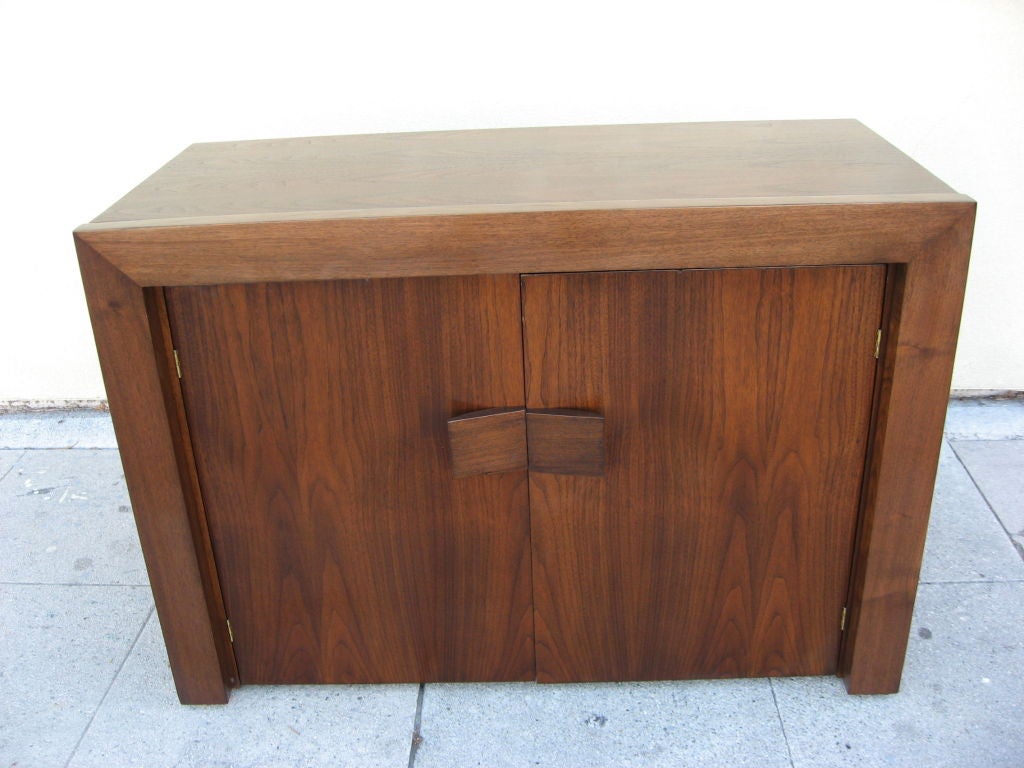 Walnut cabinet which converts into a dining table. 5 leaves are stored on the left side of the cabinet.<br />
Perfect dining table or desk for compact<br />
 apartments.