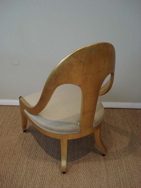 Gold leafed spoon back lounge chairs,newly upholstered with raw silk.Beautiful original patina.