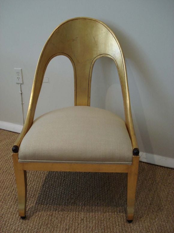 American Pair of spoon back lounge chairs