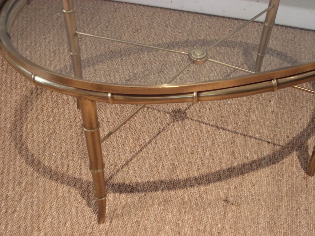 Brass faux bamboo cocktail table.