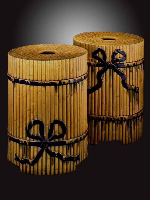 PAIR Minton majolica garden-seats, each cylindrical bamboo molded ribbon-tied seat enriched in an ochre glaze.<br />
The Minton factory was founded in 1793 in Stoke on Treat by Thomas Minton. It created high quality soft and hard past porcelains