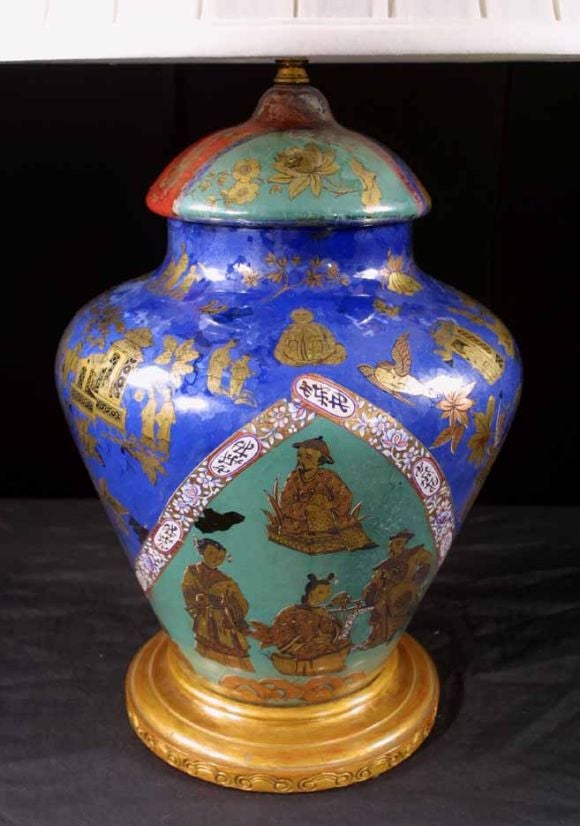Decalcomania vase and cover on a turned wood stand. The short ginger jar form covered in polychrome, chinoiserie inspired, flowers, birds and figures.<br />
Decalcomania started in the 1860's in Germany, and became popular in England in the 19th
