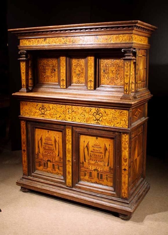 Striking Baroque court cupboard executed in oak, fruitwood and enriched with marquetry details. With a Netherlandish influence this piece is a superb example of late Renaissance pieces from Cologne, an area with a long cabinetmaking tradition. The