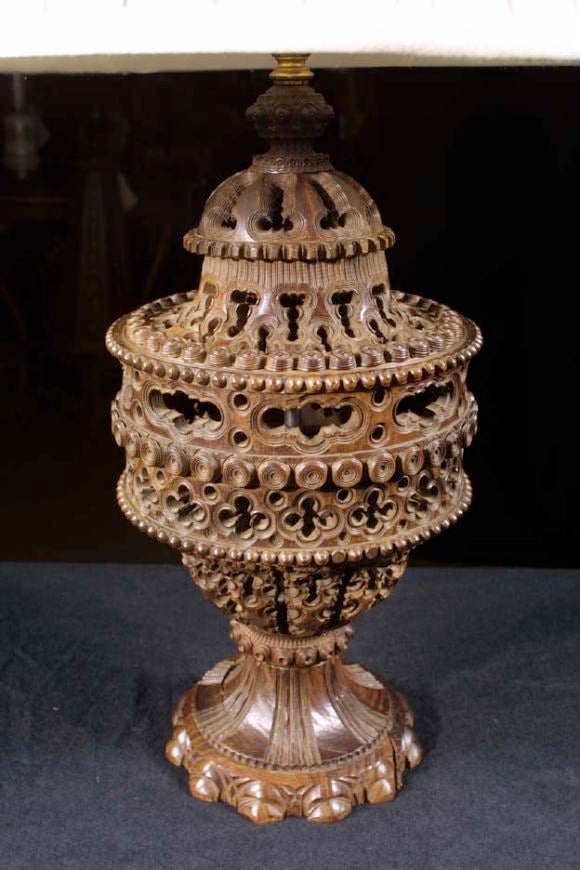 # H504 - Fine Victorian Lignum Vitae urn now mounted as a lamp. This is a rare example of drillwork which was popular during the 19th century. The classical urn has a cover with a finial top with knob decoration above a pierced dome shape. Below