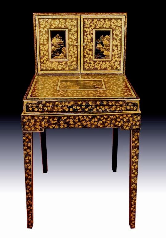 # E219 - A rare Chinese lacquer cabinet desk on stand. This piece relates to the popular English bonheurs de jour form of the late 18th century. However is was constructed and lacquered in China and made to appeal to the European taste. The top