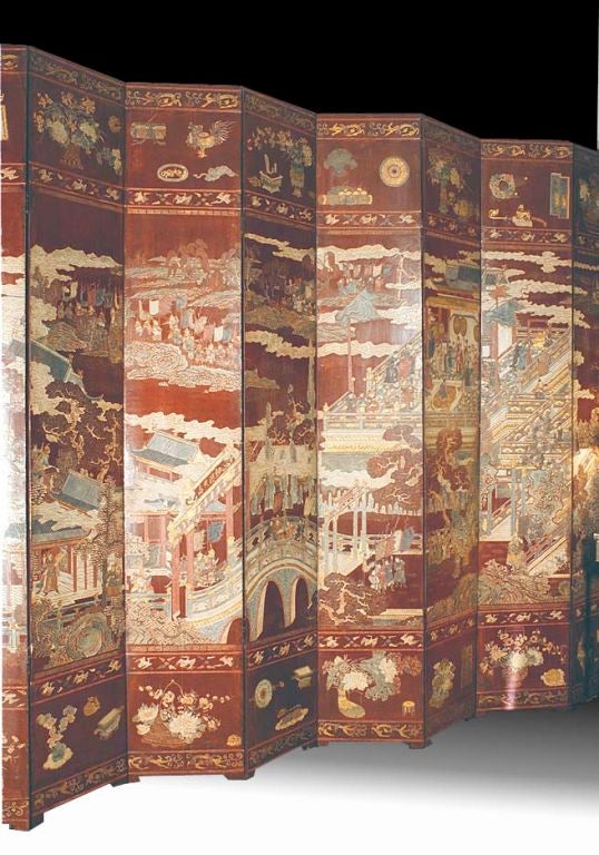 Chinese late 17th Century coromandel lacquer twelve fold screen, having a rare burgundy colored ground and enriched with gilding. The polychrome incised decoration depicts a ceremonial scene honoring an important feudal lord, General Weng, and was a
