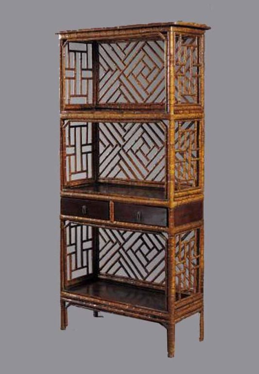 Decorative Chinese bamboo open bookcase, finished all around with intricate wrapped work. The four  rectangular  polished wood shelves supported by bamboo uprights and patterned open bamboo panels in fret work or Chinese lattice or railing designs.
