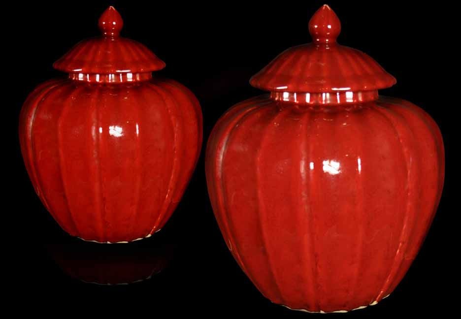 Rare PAIR San de Bouef glazed ovoid form jars with covers surmounted by finials. The overall distinctive ribbed design and color is rare to find and hard to produce. All in excellent condition.<br />
Chinese, Late 19th century<br />
<br />
See