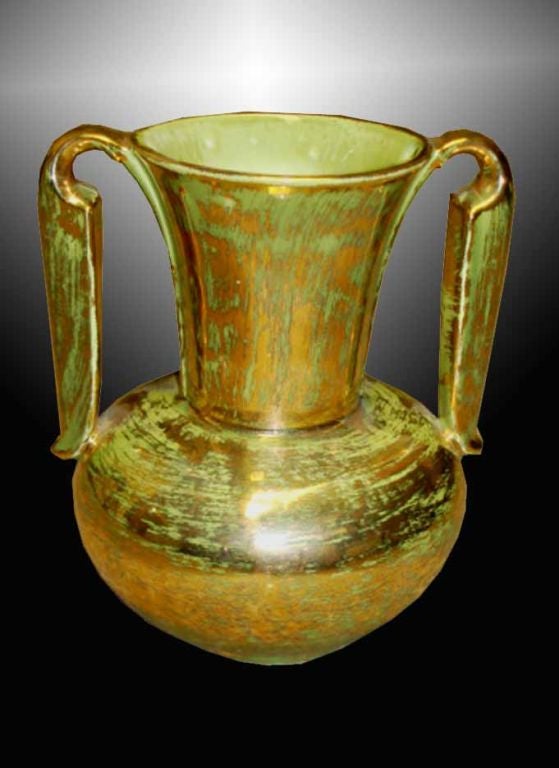 Stangl pottery vase with  factory marked on the underside. The amphora form with a pair of shaped handles. The apple green underglaze with 22k gold overglaze.<br />
American, Circa 1950's