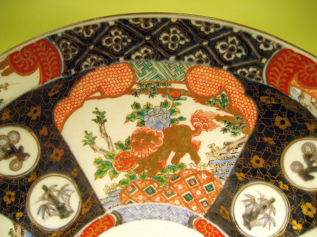 A fine Japanese Imari porcelain charger, painted intricately in the Chinese 