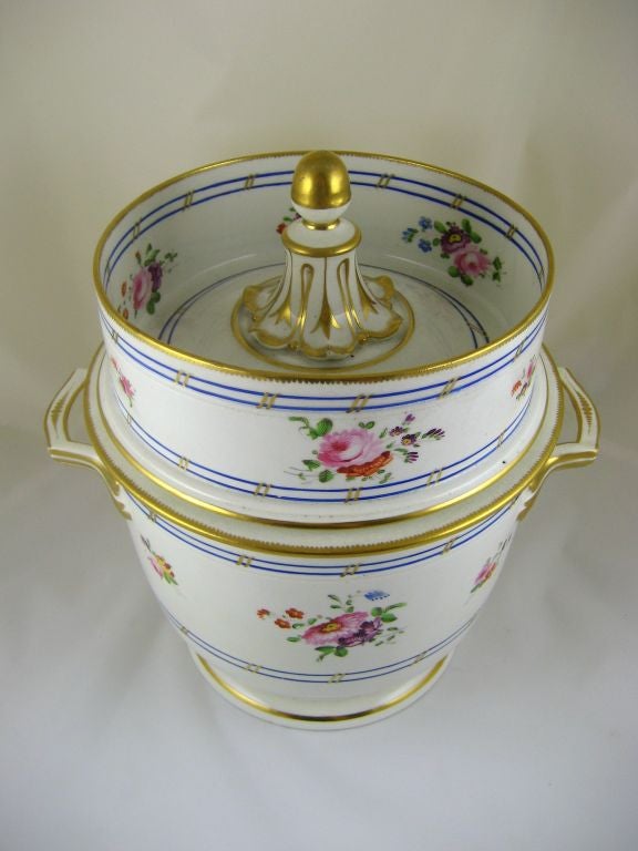 A finely-preserved porcelain Fruit cooler of Bloor-Derby manufacture, with delicate floral sprays interspersed on a fine white porcelain body. The handles and rims are gilt with restained elegance, with rounded dentils giving a gadrooned effect on