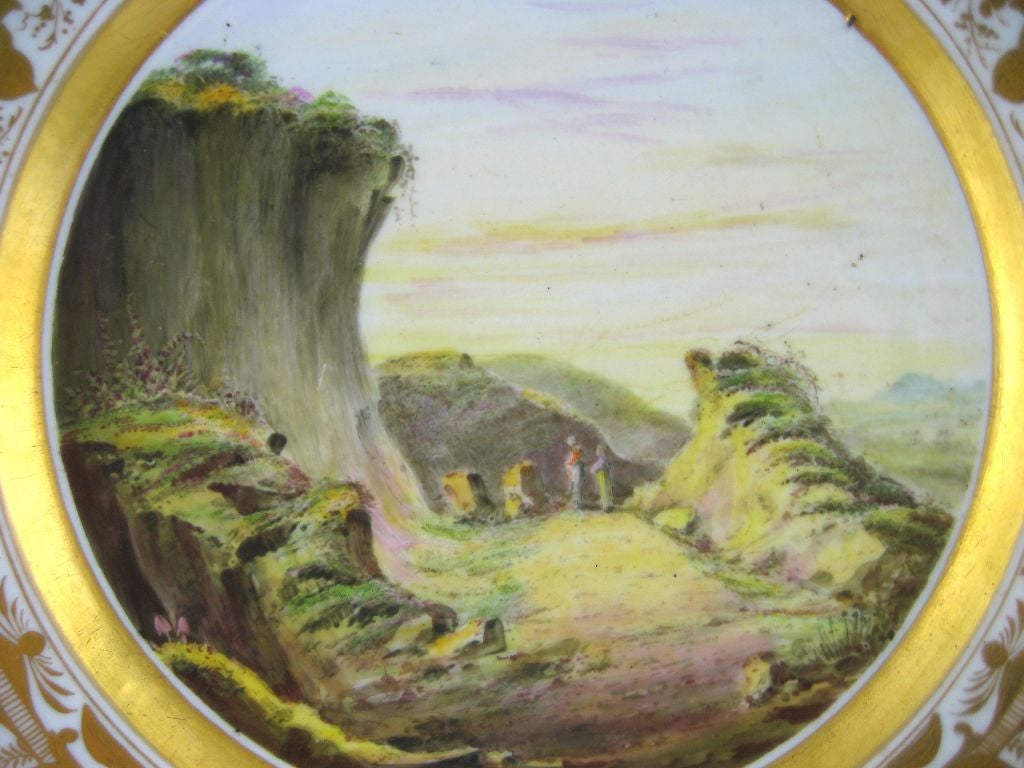 A finely-preserved Derby landscape plate, excellently painted and gilt, with a central depiction of a 'Sand Pit Near Midhurst, Sussex' as written on the reverse. <br />
<br />
The gilt borders are in the popular 'Arabesque' patterns of the early