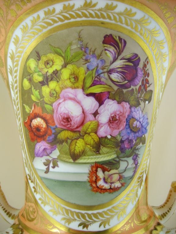An excellent Derby porcelain vase, gilt in the intricate style of the English Regency period, with a peach ground covering the majority of the body. <br />
<br />
The central panel is an arrangement of flowers, in the manner of William 'Quaker'