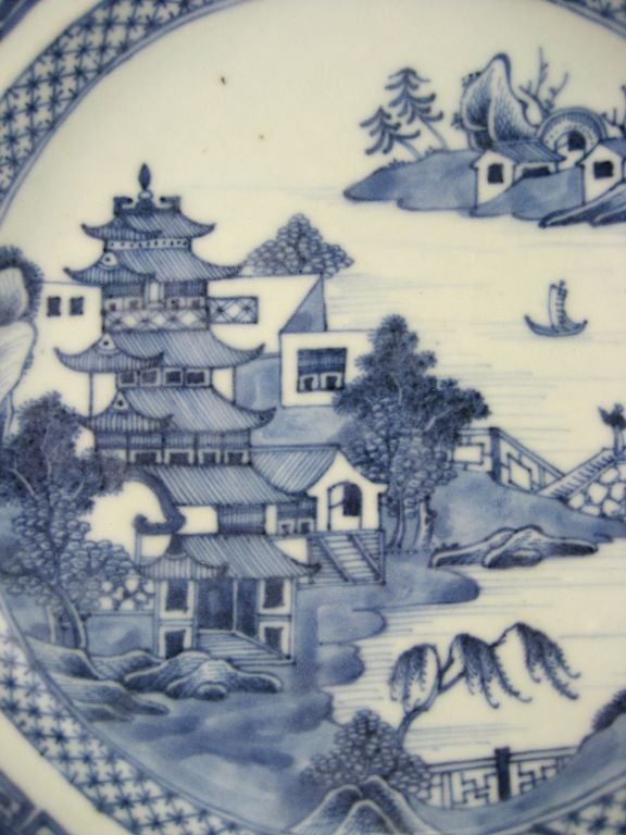 A finely-preserved Chinese export hot water dish in octagonal form, mounted with an aperture for pouring boiling water into the abscess. The piece is decorated with underglaze-blue painted designs, typical of the period, and executed with detail and