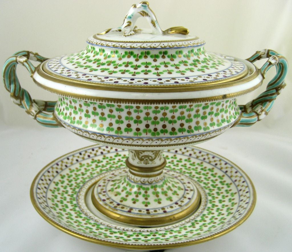 An early Ridgway bone china Sauce Tureen, cover, & stand, a beautiful regency period example of restrained forms, but with handles and finial pleasantly contrasting in their organic design, shaped as vines attached to the side of the body and lid.