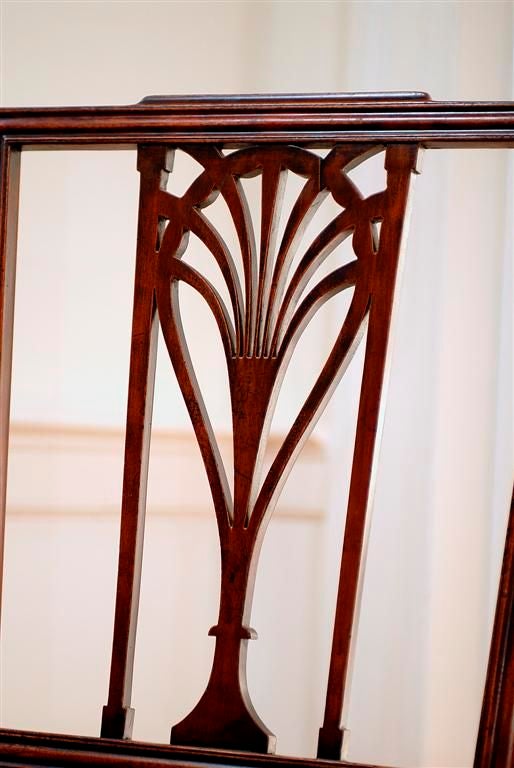 An American Federal side chair from Baltimore, MD., circa 1800.  The raised center crest rail supports a center splat with two tapering supports, and a 