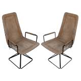 Pair of suede arm chairs