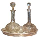 Crystal decanters on silver plate tray