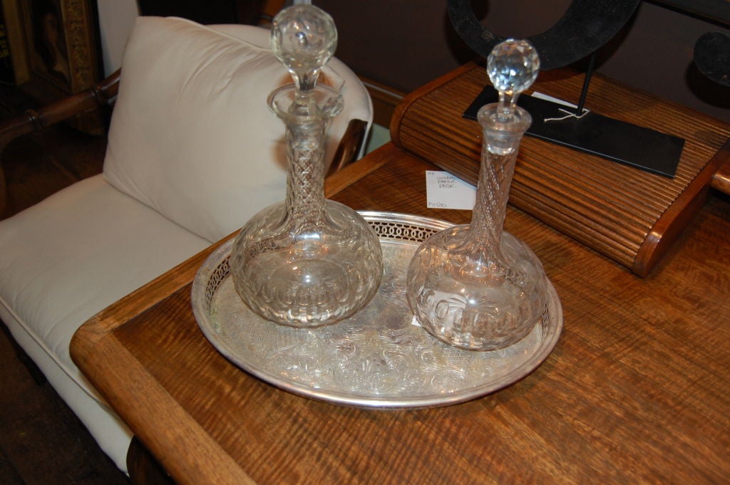 Crystal decanters on silver plate tray