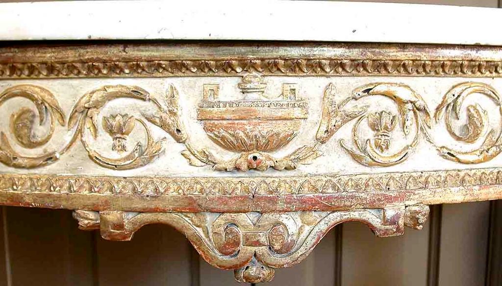 A Neoclassic Parcel-gilt and Cream-painted Demilune Console