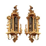 A Pair of Ornately Carved and Gilt Chippendale Sconces