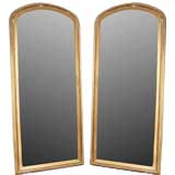 A Pair of Art Deco Parchment and Silver Gilt Mirrors