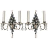 Antique A pair of mirrored silver sconces