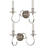 A pair of silverplate two arm sconces