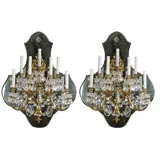 A Pair of Monumental Seven Arm Bronze and Crystal Wall Sconces