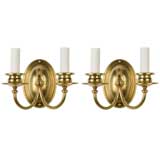 Antique A pair of two arm brass sconces