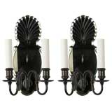 A pair of two arm mirrorback sconces