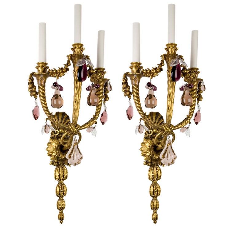 A pair of three light gilded sconces by E. F. Caldwell