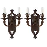 A pair of two arm sconces