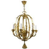 Antique An eight-light gilded chandelier by the E. F. Caldwell Co.
