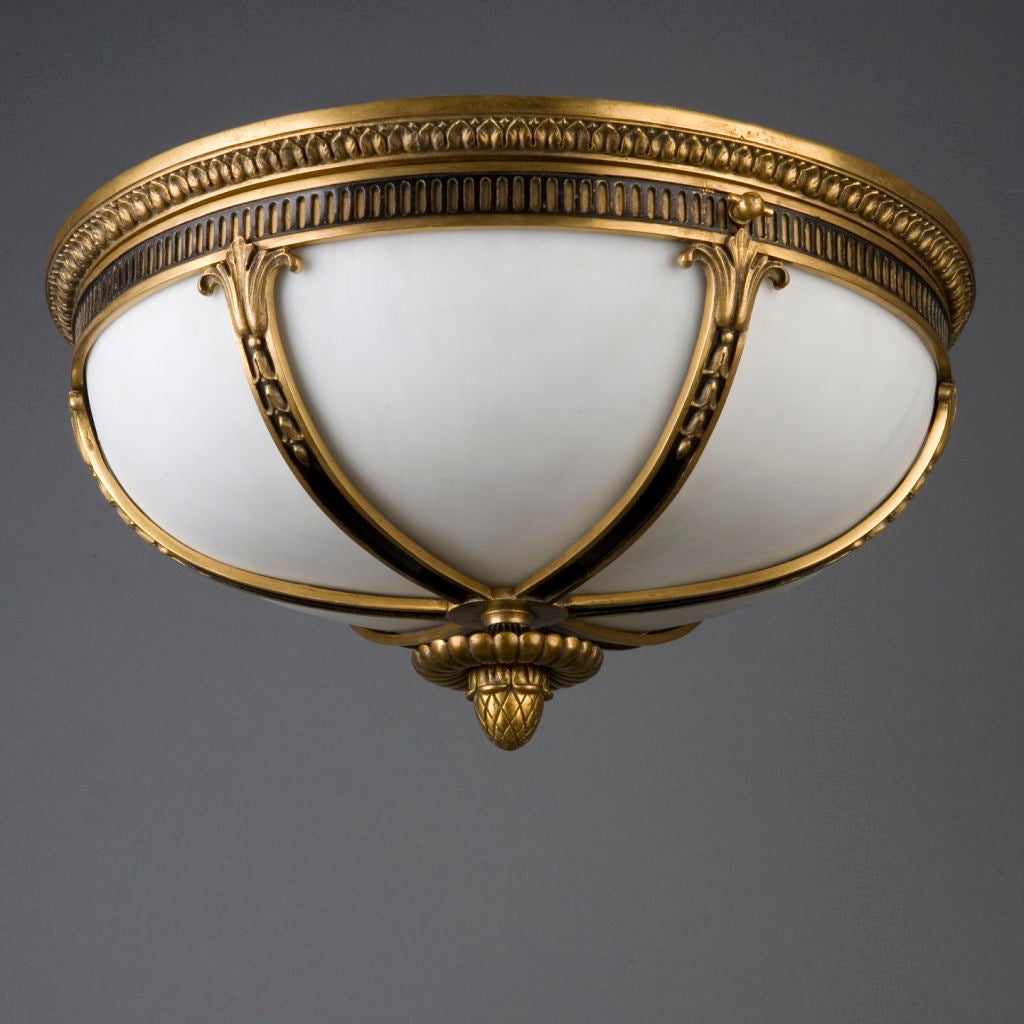 A gilded bronze and enamel flushmount by the E. F. Caldwell Co.