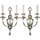 A pair of two arm silver sconces by the Sterling Bronze Co.