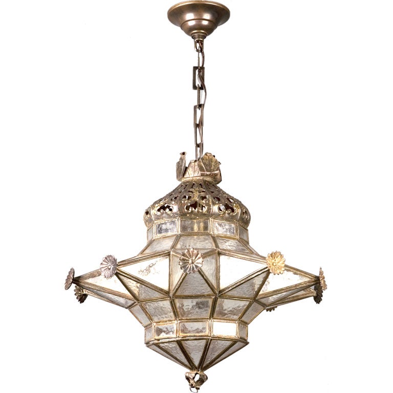 A dark brass star pendant