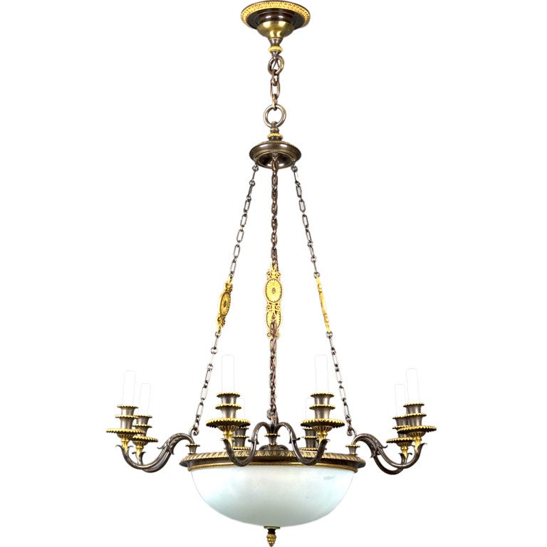 An eight light gilded bronze chandelier by Sterling Bronze Co.