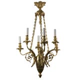A gilt bronze six arm chandelier