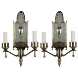 Antique A pair of nickel-over-brass two arm mirrorback sconce