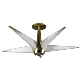 A polished brass and glass five pointed fixture
