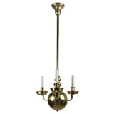 A three arm brass ball chandelier