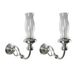 A pair of large silver hurricane sconces