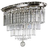 Antique An oval crystal flushmount fixture with silver fittings